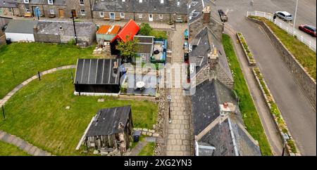 Footdee oder Fittie Aberdeen ein altes Fischerdorf am Ende des Hafens von Aberdeen, alte Teerschuppen aus Treibholz Stockfoto