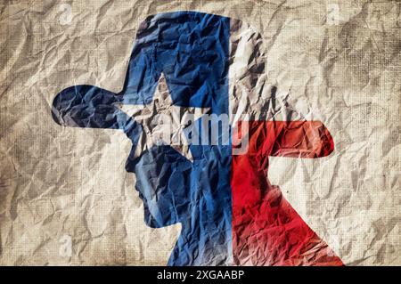 Cowboy-Silhouette mit texas-Flagge auf faltigem Papierhintergrund Stockfoto