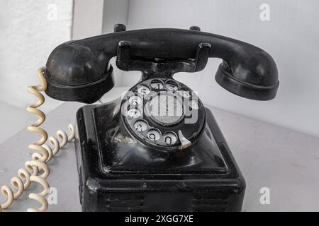 Alte schwarze retro Telefon-Disk-Händler Stockfoto