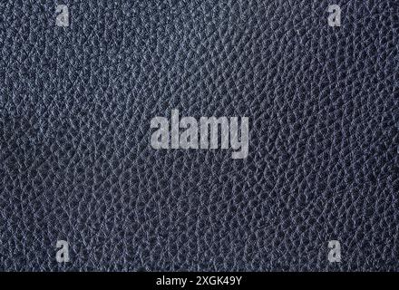 Risse und raue Textur aus dunkelgrauem Leder oder Leder mit Glitzer. Stockfoto
