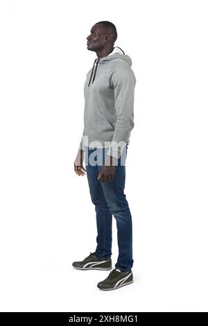 Seitliches Porträt eines afrikaners, der auf weißem Hintergrund steht Stockfoto