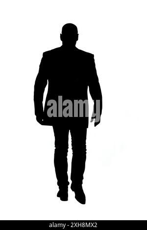 Rückansicht einer Silhouette eines Glatzköpfigen Mannes, der in einer Jacke läuft Stockfoto