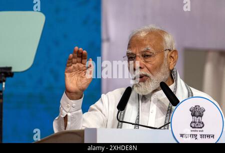Mumbai, Indien. Juli 2024. MUMBAI, INDIEN - 13. JULI: Premierminister Narendra Modi startet Infrastrukturprojekte im Wert von 29.400 Mrd. RS bei einer Veranstaltung in Goregaon, am 13. Juli 2024 in Mumbai, Indien. Modi sagte, dass laut RBI-Bericht in den letzten drei bis vier Jahren acht Milliarden neue Arbeitsplätze im Land geschaffen wurden. Modi sprach bei einer Veranstaltung im Stadtteil Goregaon von Mumbai, nachdem er den Grundstein für RS 29.000-Milliarden-Projekte im Straßen-, Schienen- und Hafensektor in der Stadt gelegt hatte. (Foto: Satish Bate/Hindustan Times/SIPA USA) Credit: SIPA USA/Alamy Live News Stockfoto