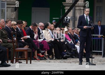 Taoiseach Simon Harris sprach während der Zeremonie zum Nationalfeiertag der Gedenkfeier zu Ehren aller Iren und Iren, die in früheren Kriegen oder im Dienst der Vereinten Nationen starben, im Royal Hospital Kilmainham in Dublin. Bilddatum: Sonntag, 14. Juli 2024. Stockfoto