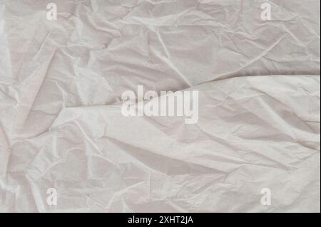 Makroaufnahme aus zerknittertem grauem Papiermaterial Stockfoto
