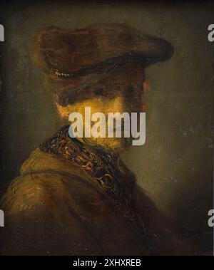 Ein Gemälde aus dem 17. Jahrhundert, das Rembrandt oder seiner Werkstatt zugeschrieben wird und einen älteren Mann mit breitkrempigem Hut darstellt. Das Porträt betont Gesichtszüge, Ausdruck und Hell-Dunkel-Beleuchtung. Das Werk spiegelt niederländische Porträttraditionen dieser Zeit wider. Stockfoto