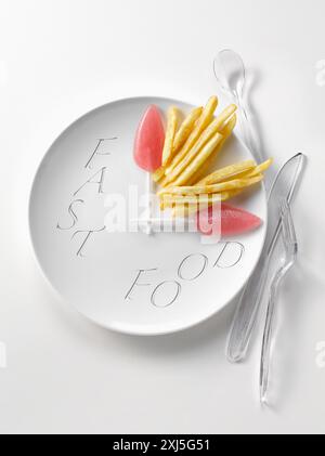 Telleruhr mit Chips und Lutschern Stockfoto