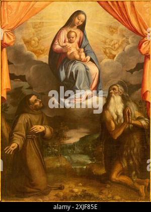 SPELLO, ITALIEN - 18. MAI 2024: Das Gemälde der Madonna mit dem hl. Franz von Assisi und dem hl. Onofrio in der Kirche Chiesa di San Severino Stockfoto