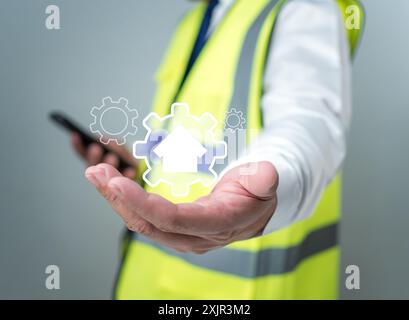 Architekt oder Ingenieur mit Symbolen für Konstruktion, Projektpräsentationsplan, Baukostenplanung, Kostenberechnung, baupla Stockfoto