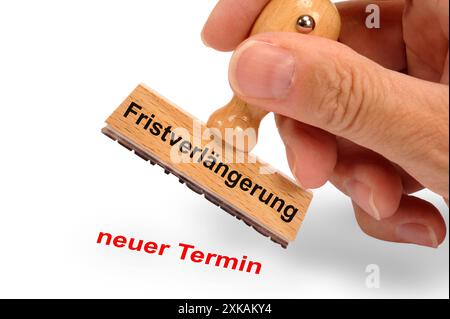 Fristverlängerung ein Holzstempel ist beschriftet mit dem Aufdruck: Fristverlängerung und dem Abdruck: neuer Termin *** Fristverlängerung A Holzst Stockfoto