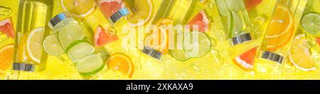 Verschiedene kalte Getränke in Flaschen, Sommer Wasserflaschen, Limonade gesunde Cocktails mit verschiedenen Zitrusfrüchten - Zitrone, Orange, Grapefruit, Stockfoto