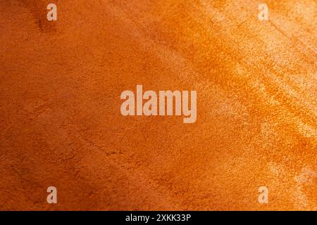 Orangefarbener Texturhintergrund aus Leder, nützlich als Hintergrund. Orangefarbener, matter Wildlederhintergrund, Nahaufnahme. Hochwertige Fotos Stockfoto