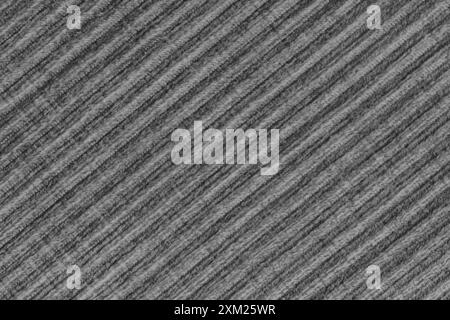 Ridge-Textur-Hintergrund aus schwarzem Velours-Cordtuch. Große gerippte, diagonale, grobe Samtgewebe, gestreifte Polstertextilien, Möbel Stockfoto
