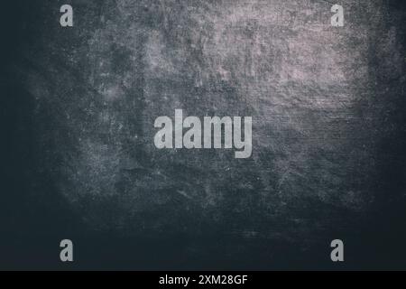 Abstrakter Hintergrund von dunkelgrauer Leinwand. Die Textur der Textiloberfläche. Altes, abgenutztes Material Stockfoto