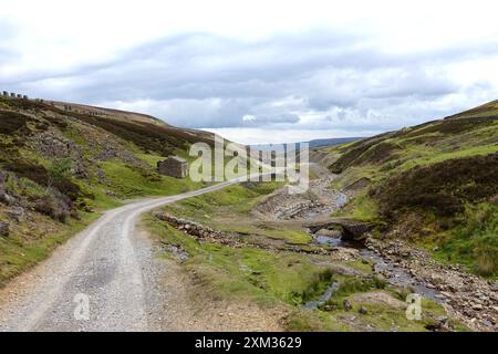 The Track to the Ruins of Old Gang Ssmelt Mill am Wainwrights Coast to Coast Path im Swaledale, Yorkshire Dales National Park. England, Großbritannien Stockfoto