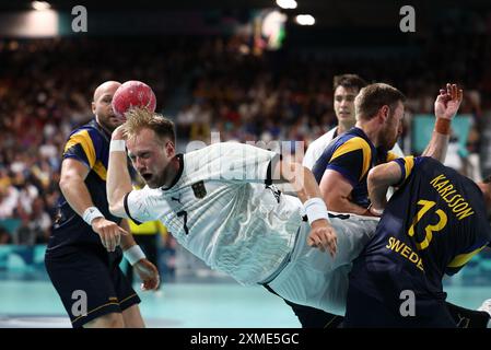 Julien Mattia/Le Pictorium - Handball - Paris 2024 - Deutschland, Schweden. Juli 2024. Frankreich/Ile-de-France (Region)/Paris - Deutschland gewinnt am 27. Juli 2024 in der Paris Sud Arena in Paris das fünfte Spiel der Gruppe A der Vorrunde der Olympischen Spiele der Männer zwischen Schweden und Deutschland. Quelle: LE PICTORIUM/Alamy Live News Stockfoto