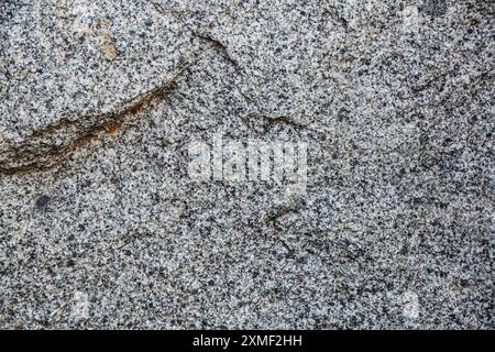 Granitstein Textur Hintergrund. Nahaufnahme der Steinoberfläche mit perfekten Details. Stockfoto