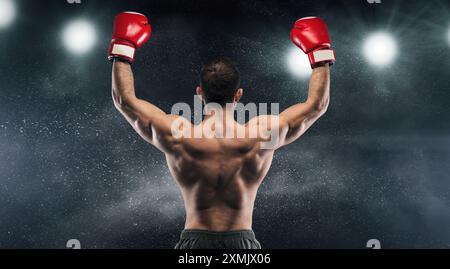 Boxer-Champion genießt seinen Sieg im Licht Stockfoto