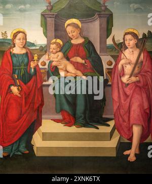 PERUGIA, ITALIEN - 18. MAI 2024: Das Gemälde der Madonna mit der Heiligen Maria Magdalen und St. Sebastian in der Kirche Basilica di San Pietro Stockfoto