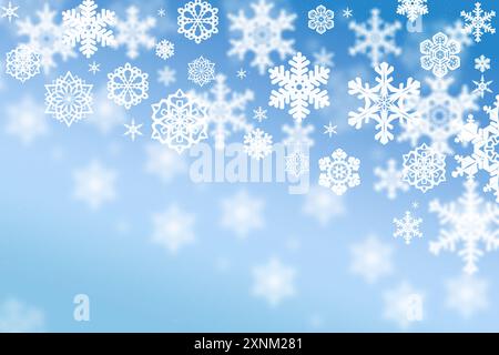 Ein atemberaubendes Winterwunderland entfaltet sich, während zarte weiße Schneeflocken anmutig vor dem Hintergrund des sanften blauen Himmels herabgleiten. Stockfoto