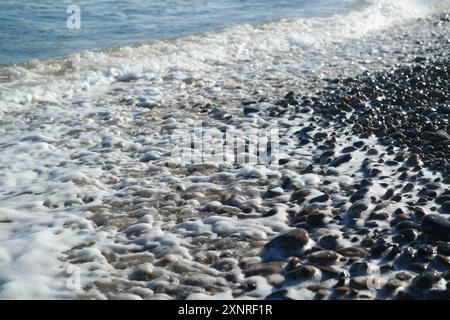 Meereskiesel am Strand, Nahaufnahme eines Fotos Stockfoto