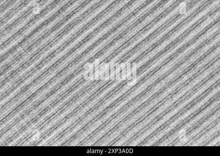 Ridge-Textur-Hintergrund aus Velours-Cordgrauen Tuch. Große gerippte, diagonale, grobe Samtgewebe, gestreifte Polstertextilien, Möbel Stockfoto