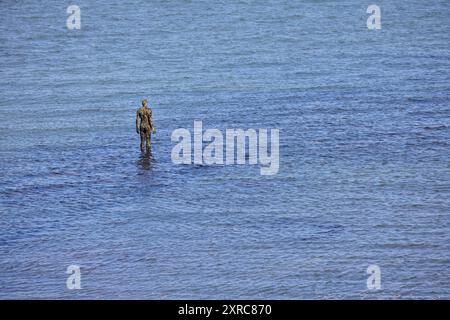 Antony Gormley Eine Andere Zeitstatue. EIN WEITERES MAL ist eine Serie von hundert massiven gusseisernen Figuren von Antony Gormley Stockfoto