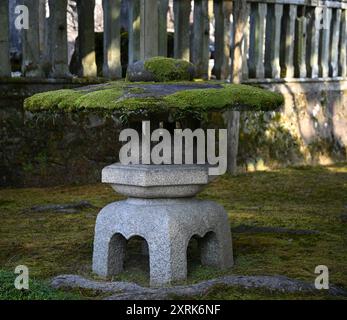 Landscape with scenic view of Kotoji-tōrō, a two-legged stone lantern the most well-known symbol of Kenroku-en garden in Kanazawa, Ishikawa Japan. Stock Photo