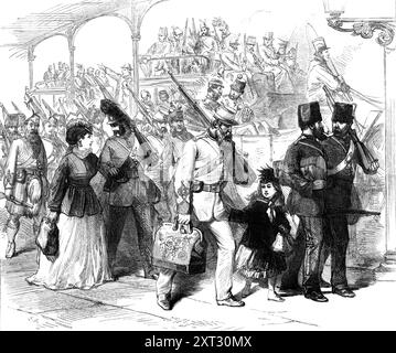 The Easter Volunteer Review: Early Arrivals at Brighton, 1870. "Der jährliche Ostermontag-Bericht und Scheinkampf des Freiwilligenkorps der Großstädte und der Heimatbezirke fand in Brighton statt, mit dem Vorteil des bestmöglichen Wetters... da Brighton eine Urlaubsstadt ist, in der Londoner sicher sind, komfortable Unterkünfte für sich und ihre Familien zu finden. Dank der Meeresluft und ausreichender Vergnügungsmöglichkeiten gingen viele Freiwillige und ihre Freunde entweder am Samstag oder Karfreitag nach unten... die meisten von ihnen kamen mit der Bahn an. Unsere Abbildung zeigt die Szene bei Stockfoto