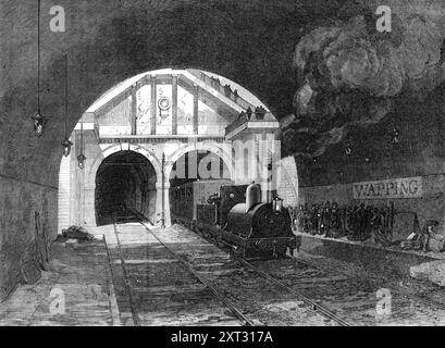 Eisenbahn durch den Thementunnel, 1870. "Der erste Abschnitt der East London Railway, der sich von New-Cross nach Wapping erstreckt - eine weitere Verbindung im großen äußeren Kreis der Kommunikation, die die Metropole schließlich umgeben wird, und die, selbst in ihrem unvollständigen Zustand, das ist ein wichtiges Transportmittel zwischen der Nord- und Südseite der Themse - wurde am 7. Dezember eröffnet... alle Arbeiten wurden von Herrn Lucas und Wise, Bauunternehmer, unter der Leitung von Herrn Benjamin Burleigh, dem amtierenden Ingenieur, gebaut. nach den Plänen von Mr. Hawkshaw, dem Ingenieur des li Stockfoto