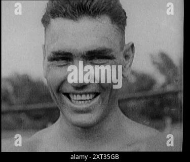 Jack Dempsey, der für die Kamera grimmt, 1921. Aus "Time to Remember - The Time When Little Happened", 1921 (Reel 3); Ereignisse von 1921 - Irish treaty, Mad Stunts and Newspapers at Work. Stockfoto