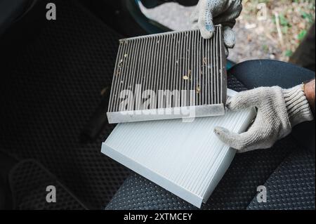 Der Hauptschalter wechselt den Innenraumluftfilter des Fahrzeugs. Stockfoto