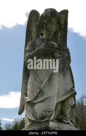 Angel auf dem Knie Stockfoto