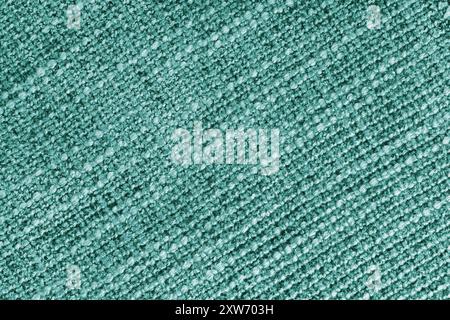 Polster in türkisfarbenem Jacquard-Stoff mit grober Webstruktur. Textilhintergrund, Möbel Textilmaterial, Tapete, Hintergrund. Tuch s Stockfoto