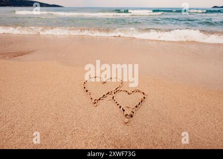 Die Inschrift Ich liebe dich am Meer mit Palmen Stockfoto