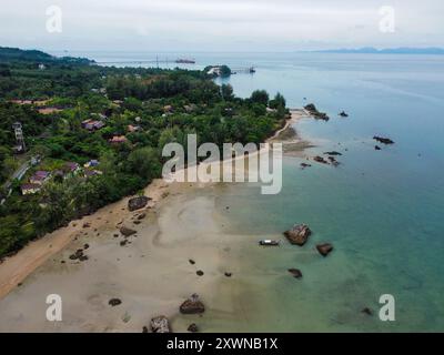 Aerial view of a tropical beach in Thailand with long tail boats Stock Photo