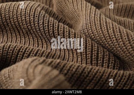 Textur von braunem Strickstoff als Hintergrund, Nahaufnahme Stockfoto