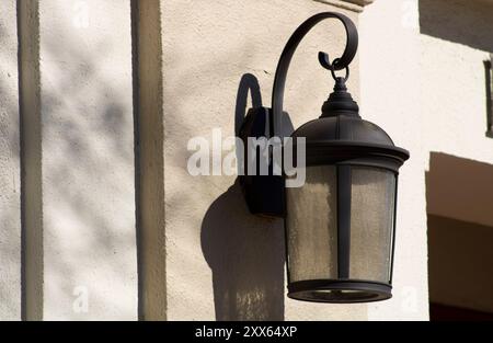 iron lamp light on side of church Stock Photo