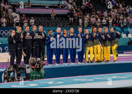 Gold Medal winning USA Women's  Gymnatics Team All-around L-R Simone Biles, Jade Carey, Jordan Chiles, Sunisa Lee Hezly Rivera along side -L- Team Ita Stock Photo