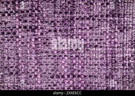 Textur aus rosa Jacquard-Gewebe aus grobem Gewebe, Nahaufnahme. Gemischte Farbe, meliertes Tuch. Material für Heimtextilien, Polster und Vorhangdekor, g Stockfoto