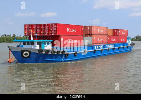 Mekong River, Vietnam/Cambodia. Aug 24,2024: Vietnamese container ship transports containers on the Asian waterway, one of Asia's biggest waterways. Maritime shipping freight transport is source of geopolitical tensions, environmental concerns & controversies as Cambodian PM plans to build Funan Techo canal (officially Tonle Bassac Navigation Road & Logistics System Project), a $1.7 billion China-backed project to connect Phnom Penh to Kampot seaport, diverting its goods for export directly to its own coast rather than via the Hanoi-controlled Mekong Delta. Credit: Kevin Izorce/Alamy Live News Stock Photo