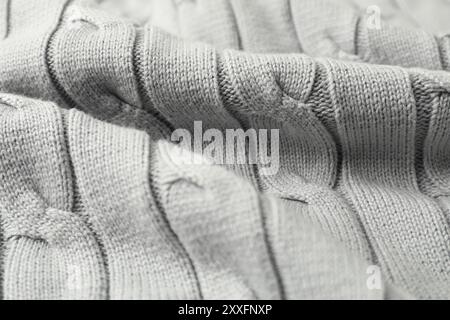 Textur von weißem gestricktem Stoff als Hintergrund, Nahaufnahme Stockfoto