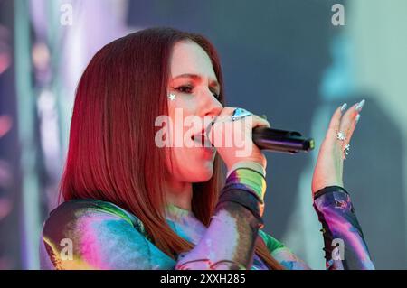 Manchester, UK. 24th August, 2024. Katy B at Manchester Pride 2024 . Crowds were at capacity and even watched from a nearby multistorey carpark. This year's pride theme is 'Buzzin To Be Queer - A Hive of Progress' . The symbol of the Manchester Bee led the parade. Headline performances are from Jessie J, Loreen, Sugababes, Rita Ora and The Greatest Showman star Keala Settle. Mark Fletcher, CEO of Manchester Pride, also appeared ahead of the  iconic symbol of the Manchester Bee. Manchester UK.  Credit: GaryRobertsphotography/Alamy Live News Stock Photo