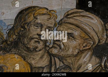 Zwei Gesichter im Detail des Freskos von Giovanni Antonio Bazzi (1477–1549), zu seinen Lebzeiten als Il Sodoma bekannt, in der Loggia del Giudice (Loggia der Richter), einem Portikus im Innenhof des Palazzo Comunale in San Gimignano, Toskana, Italien. Das komplette Fresko zeigt Sant'Ivo oder Saint Ives als jungen Richter, der den Armen Gerechtigkeit gewährt, während außerhalb einer Gruppe reicher Männer und Frauen, einschließlich der beiden Männer in diesem Bild, auf den Eintritt warten. Stockfoto
