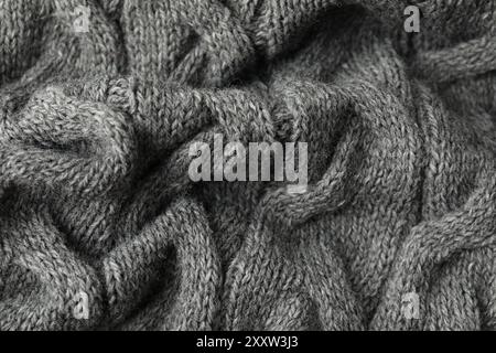 Textur aus grauem Strickstoff als Hintergrund, Nahaufnahme Stockfoto