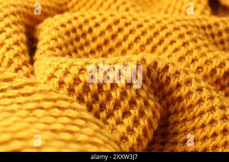 Textur aus orangefarbenem Strickgewebe als Hintergrund, Nahaufnahme Stockfoto