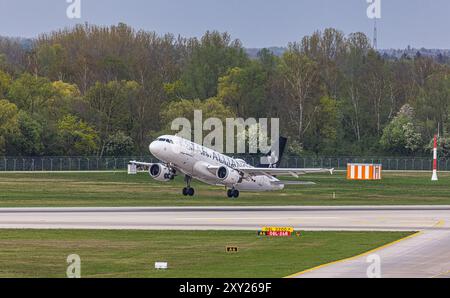 München, 7. April 2024: Vom Flughafen München startet ein Lufthansa CityLine Airbus A319-114. Das Flugzeug trägt die Star Alliance-Lackierung. Regi Stockfoto