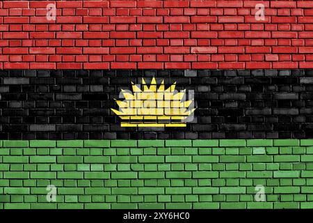 Flagge von Biafra auf Ziegelwand gemalt Stockfoto