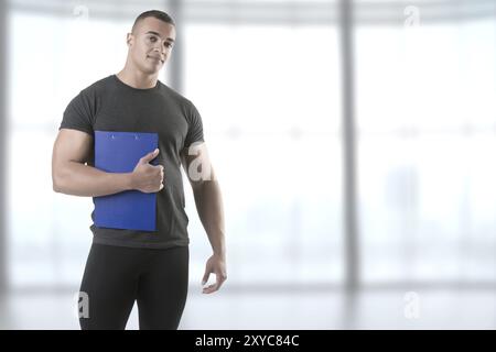 Personal Trainer, mit einem Pad in der hand Stockfoto