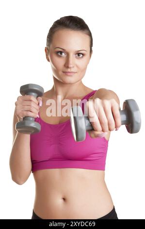 Frau mit Hanteln in einem Fitnessstudio trainieren Stockfoto